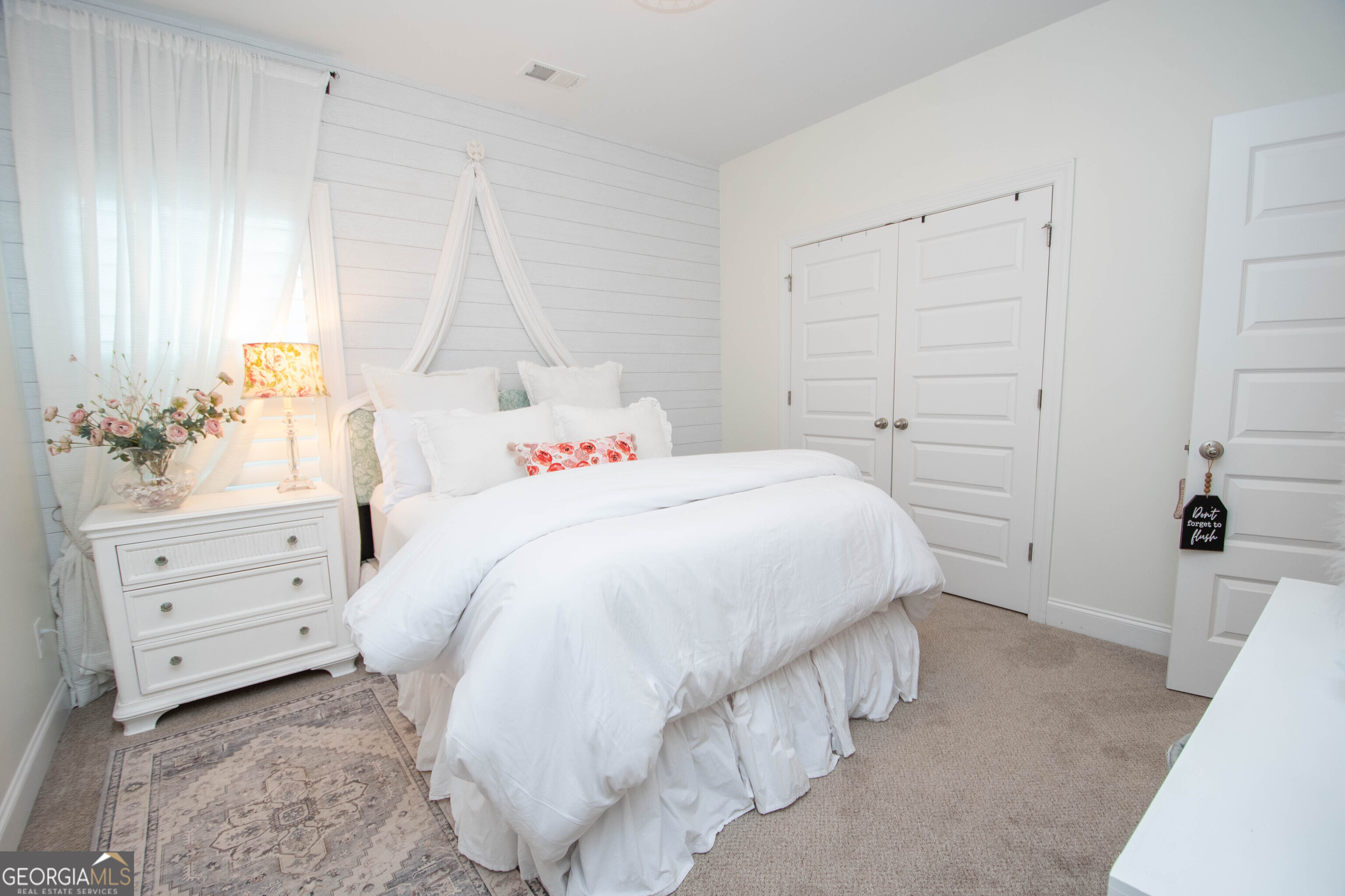 6 Delaware Way Newnan, GA 30265 - Photo 28 of 42 a bedroom with a bed and a window