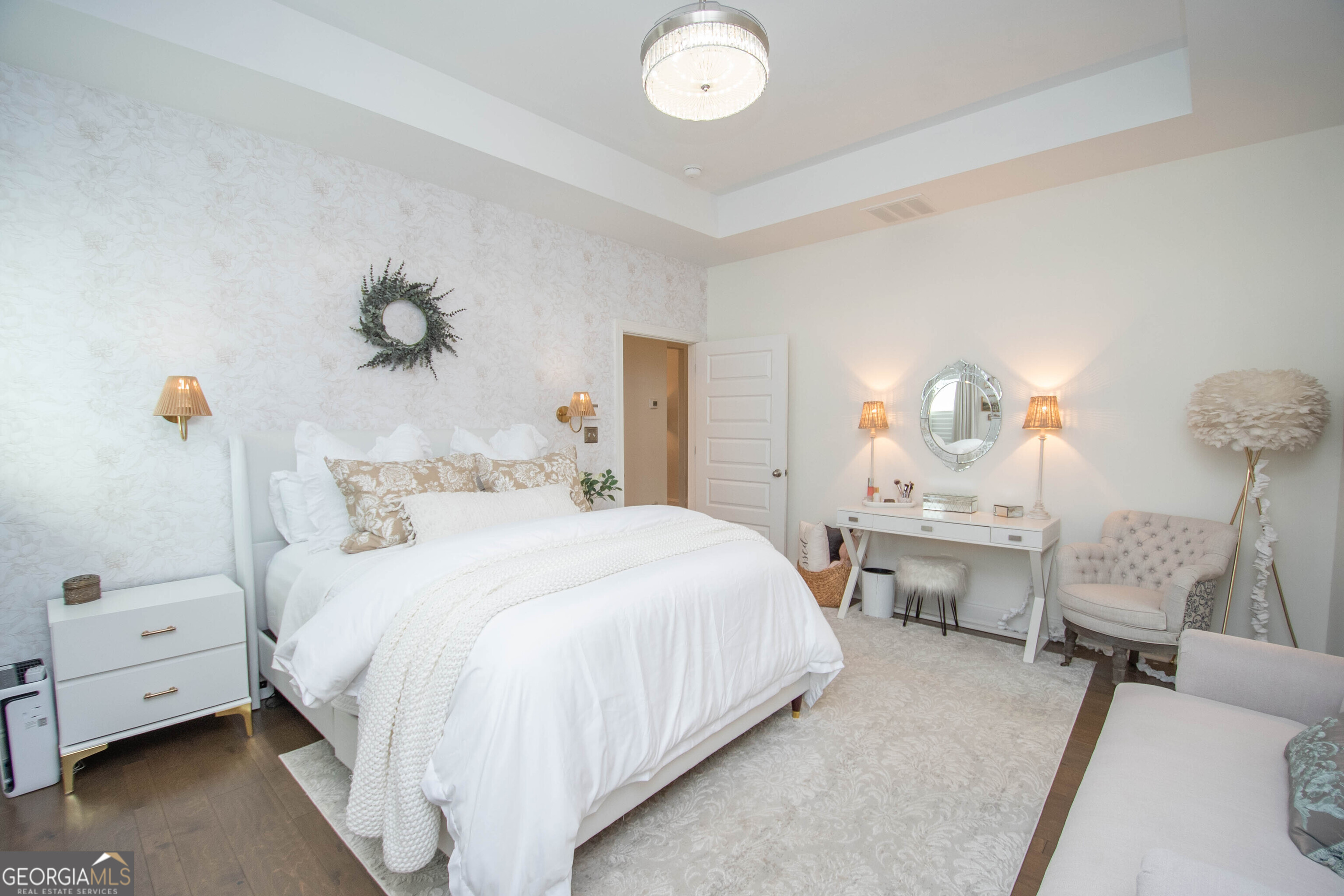 6 Delaware Way Newnan, GA 30265 - Photo 30 of 42 a bedroom with a bed and a chandelier