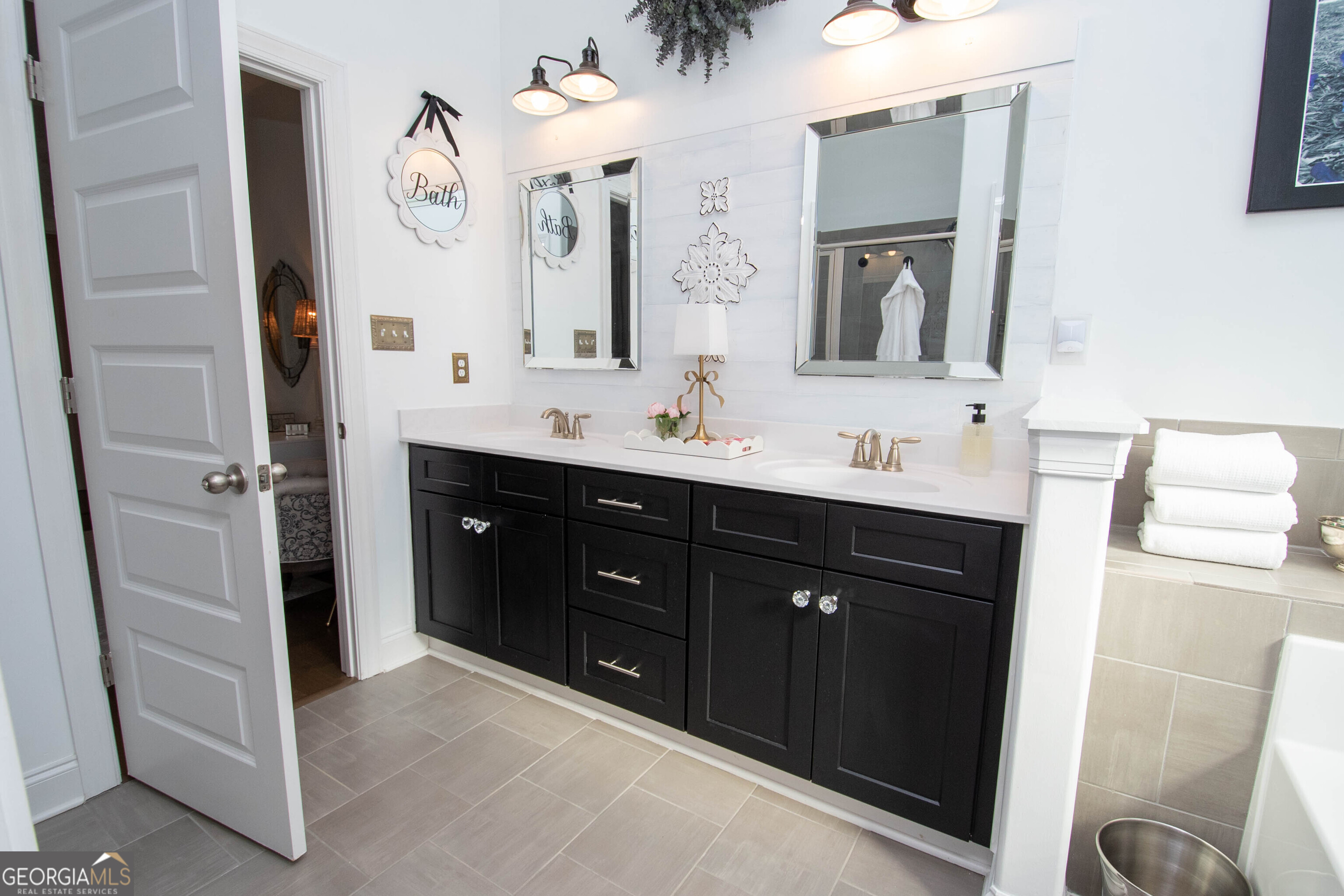 6 Delaware Way Newnan, GA 30265 - Photo 34 of 42 a bathroom with a double vanity sink and a mirror