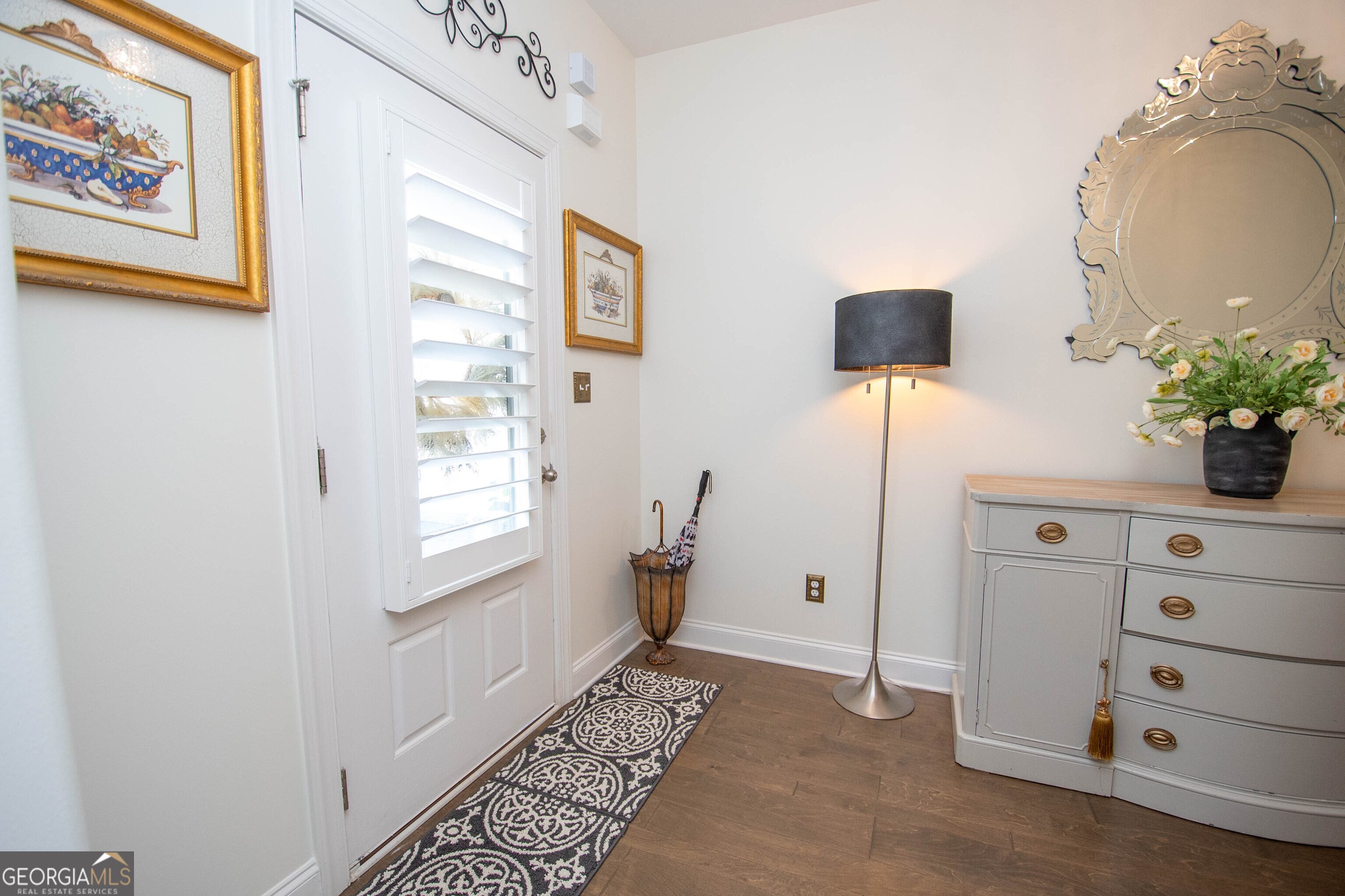 6 Delaware Way Newnan, GA 30265 - Photo 7 of 42 a view of an entryway with wooden floor