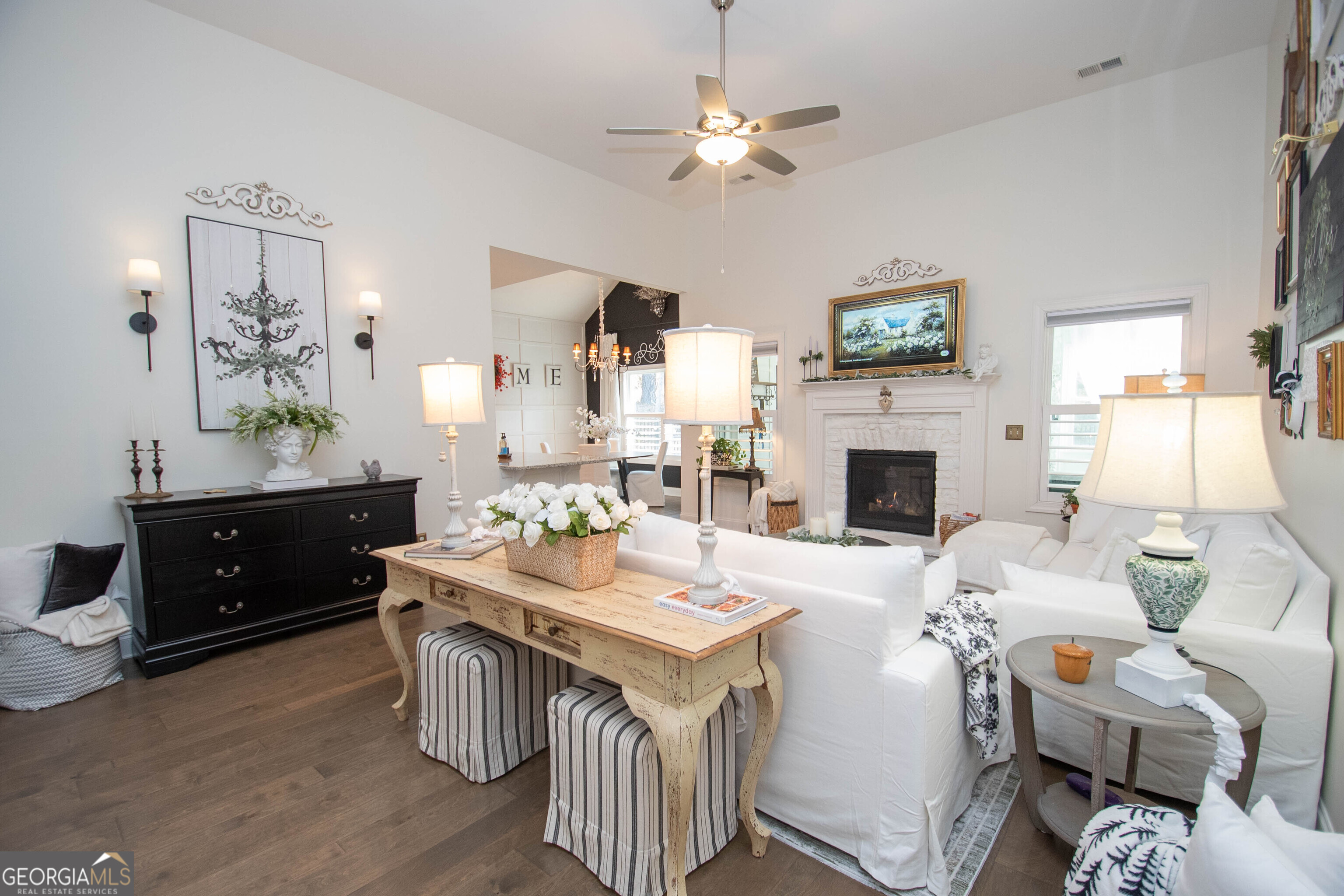 6 Delaware Way Newnan, GA 30265 - Photo 9 of 42 a living room with furniture a fireplace and a flat screen tv