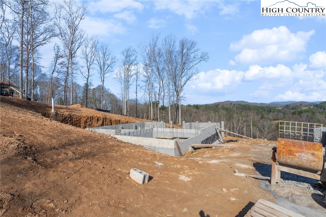 403 Autumn Leaf Way Crumpler, NC 28617 - Photo 7 of 16 a view of a lake with couches and city view