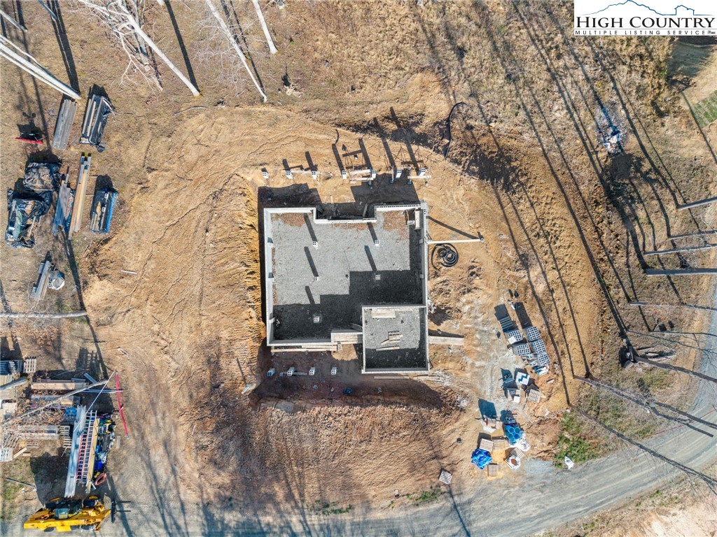 403 Autumn Leaf Way Crumpler, NC 28617 - Photo 8 of 16 a aerial view of a brick house with large trees