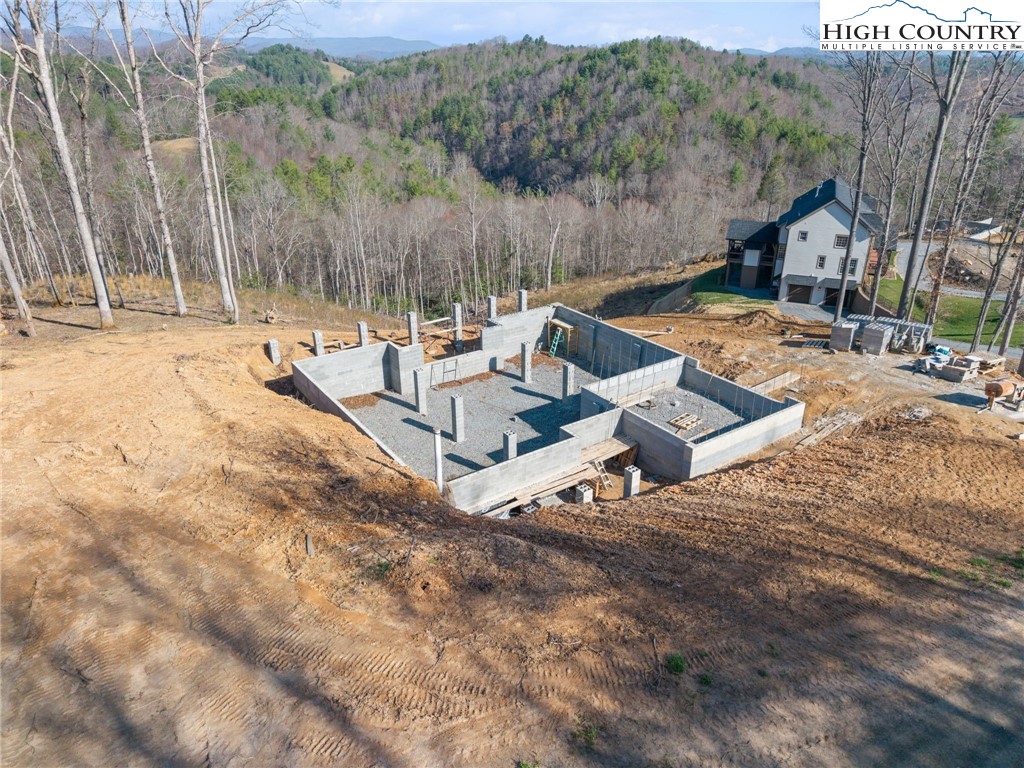 403 Autumn Leaf Way Crumpler, NC 28617 - Photo 9 of 16 a view of a swimming pool with a patio