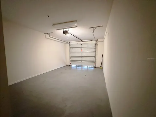 a view of empty room with stairs