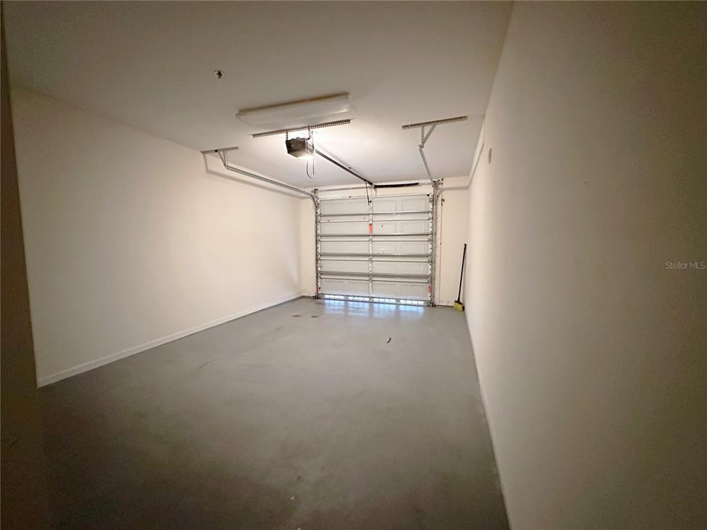 12843 Madison Pointe Circle, Unit 201 Orlando, FL 32821 - Photo 28 of 53 a view of empty room with stairs