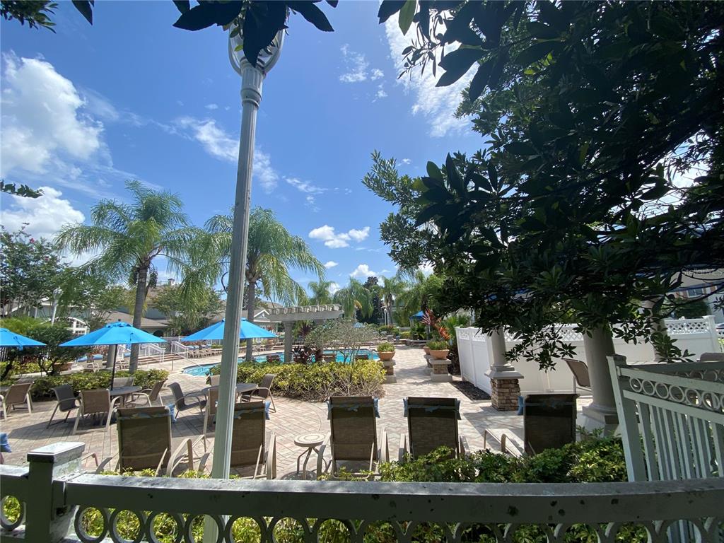 12843 Madison Pointe Circle, Unit 201 Orlando, FL 32821 - Photo 30 of 53 a front view of a house with garden