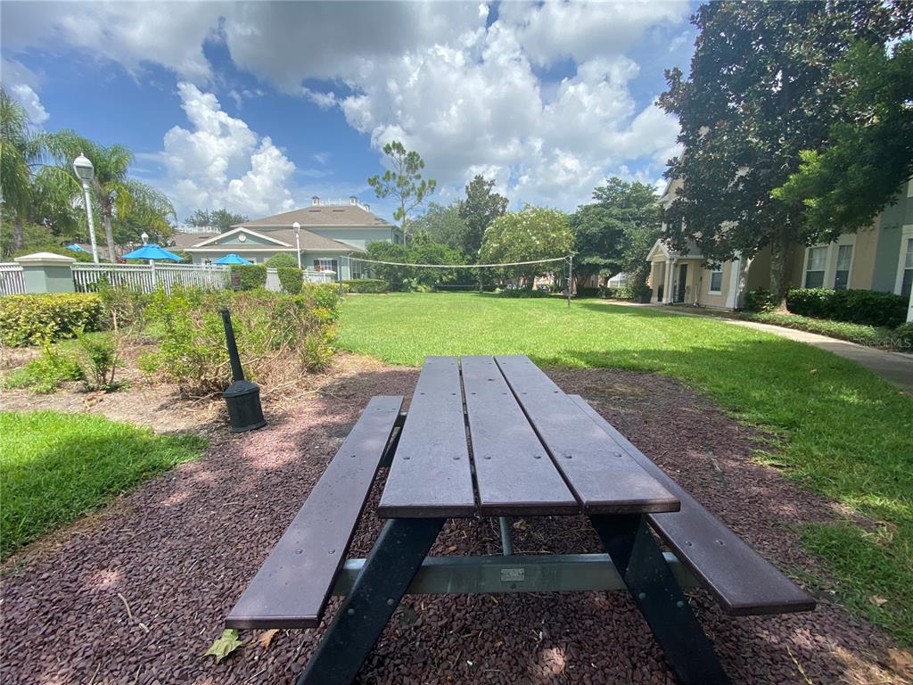 12843 Madison Pointe Circle, Unit 201 Orlando, FL 32821 - Photo 40 of 53 a view of a yard with an outdoor space