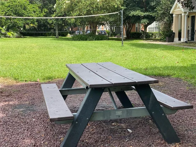 a house view with a sitting space and garden