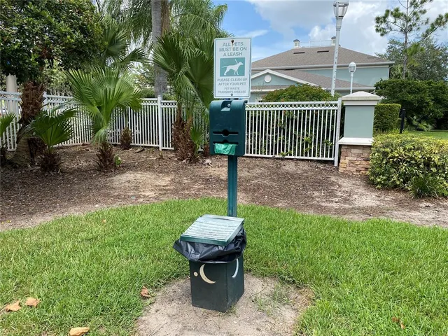 a view of a backyard with a garden and entertaining space