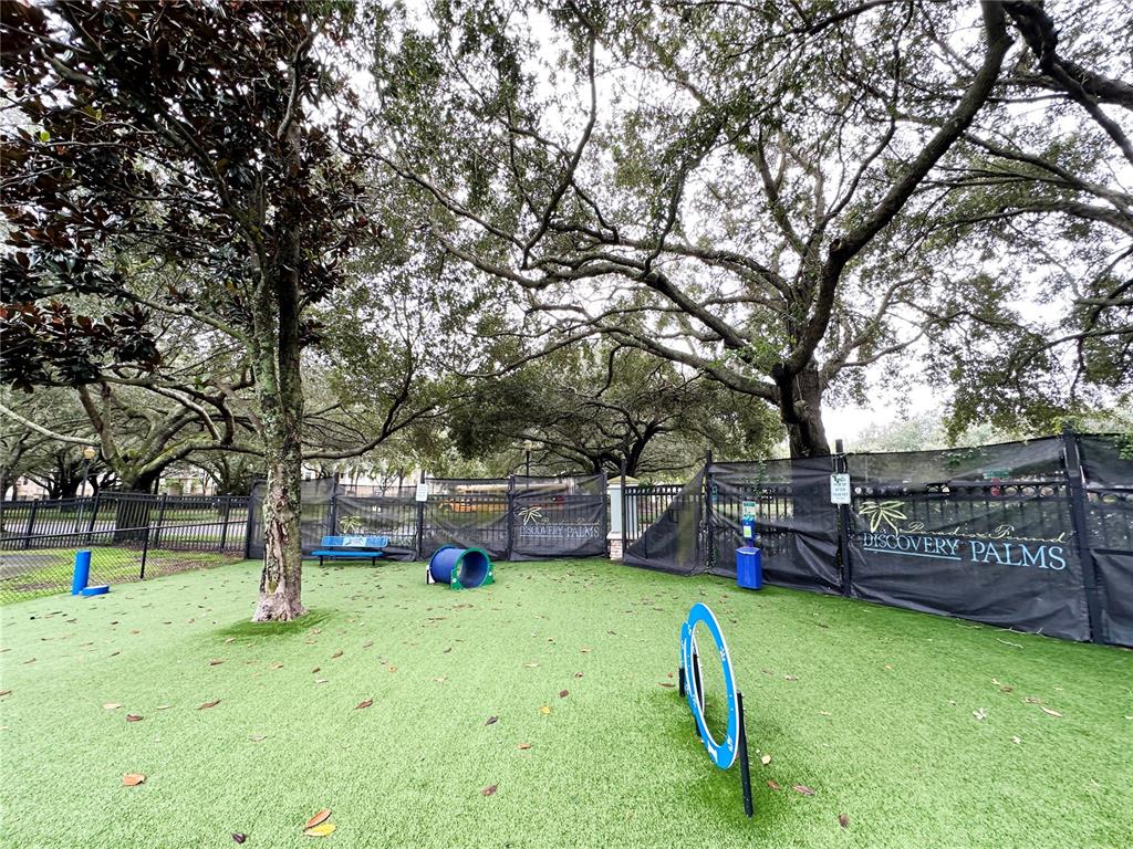 12843 Madison Pointe Circle, Unit 201 Orlando, FL 32821 - Photo 46 of 53 a house view with a sitting space and garden