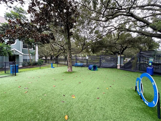 a view of a house with wooden fence