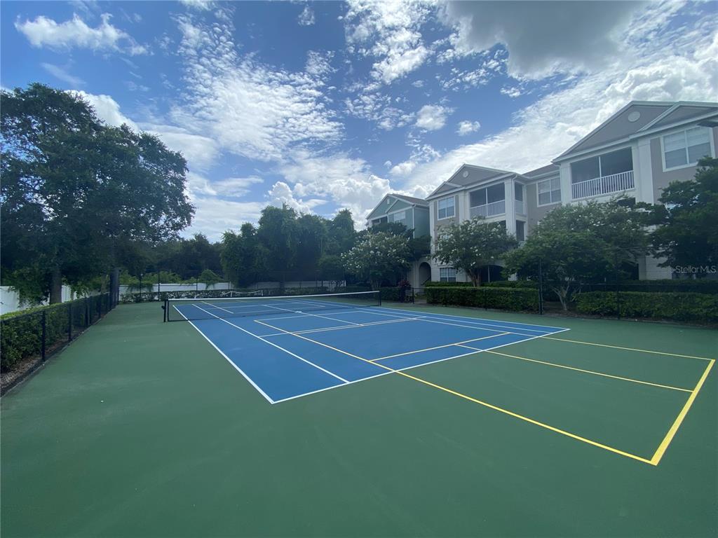 12843 Madison Pointe Circle, Unit 201 Orlando, FL 32821 - Photo 53 of 53 a view of a tennis court