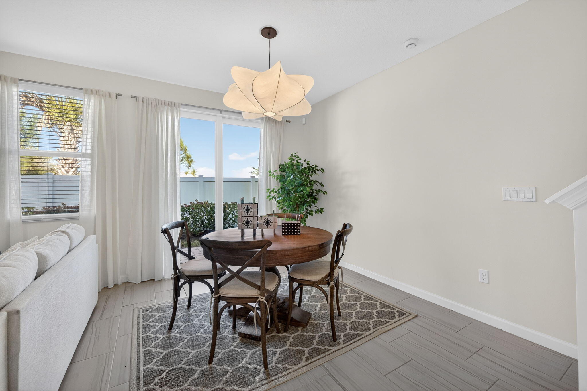 5624 Southeast Edgewater Circle Stuart, FL 34997 - Photo 11 of 33 a view of a dining room with furniture and wooden floor