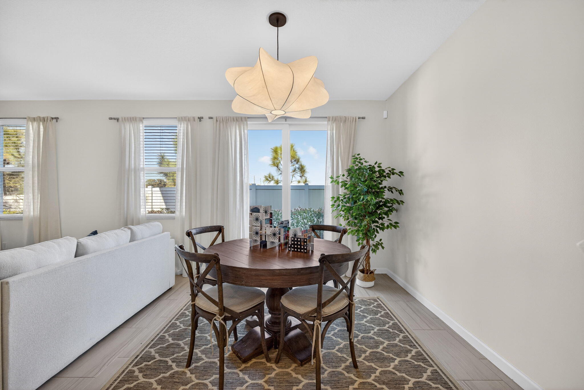 5624 Southeast Edgewater Circle Stuart, FL 34997 - Photo 13 of 33 a dining room with wooden table and chairs
