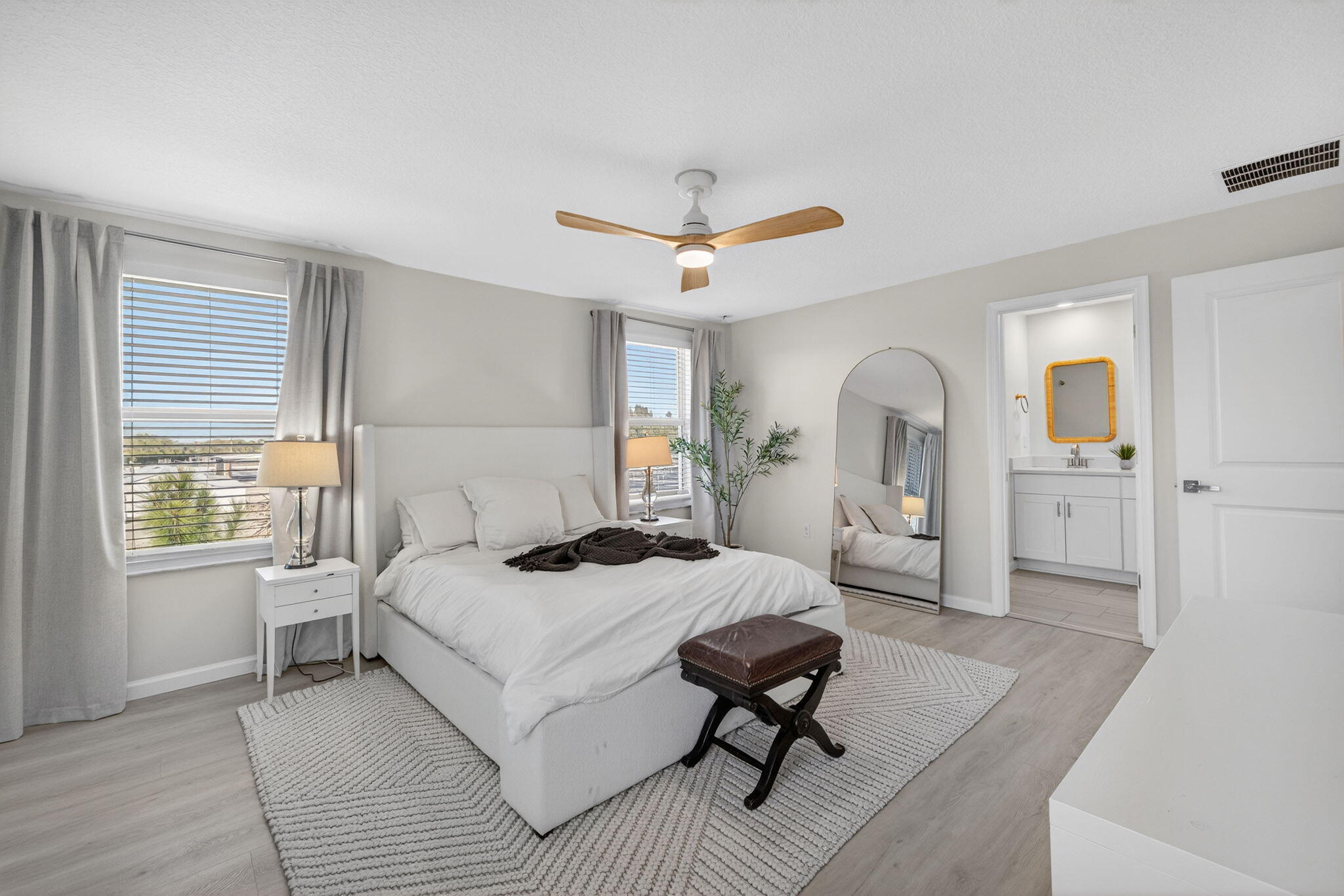 5624 Southeast Edgewater Circle Stuart, FL 34997 - Photo 15 of 33 a bedroom with a bed couch and a window