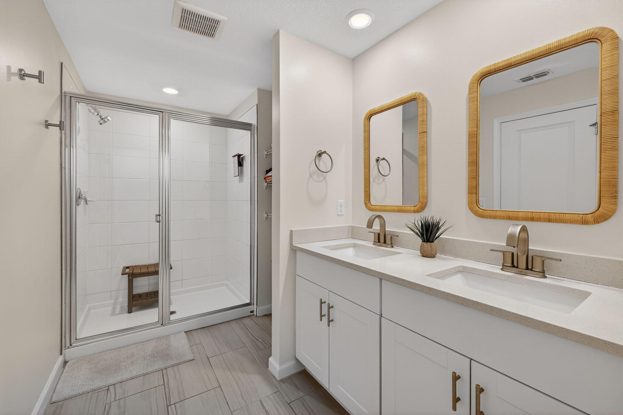 5624 Southeast Edgewater Circle Stuart, FL 34997 - Photo 18 of 33 a spacious bathroom with a double vanity sink mirror and