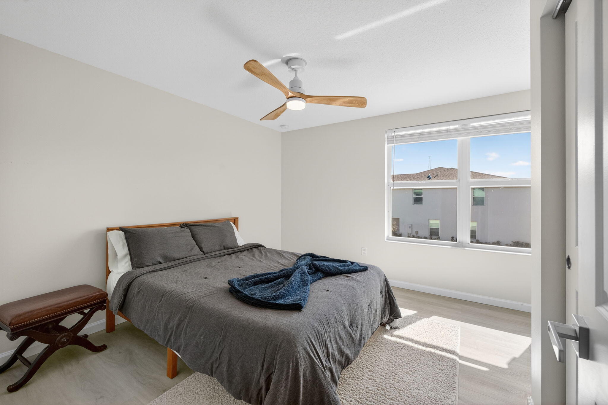5624 Southeast Edgewater Circle Stuart, FL 34997 - Photo 19 of 33 a bedroom with a bed and a window