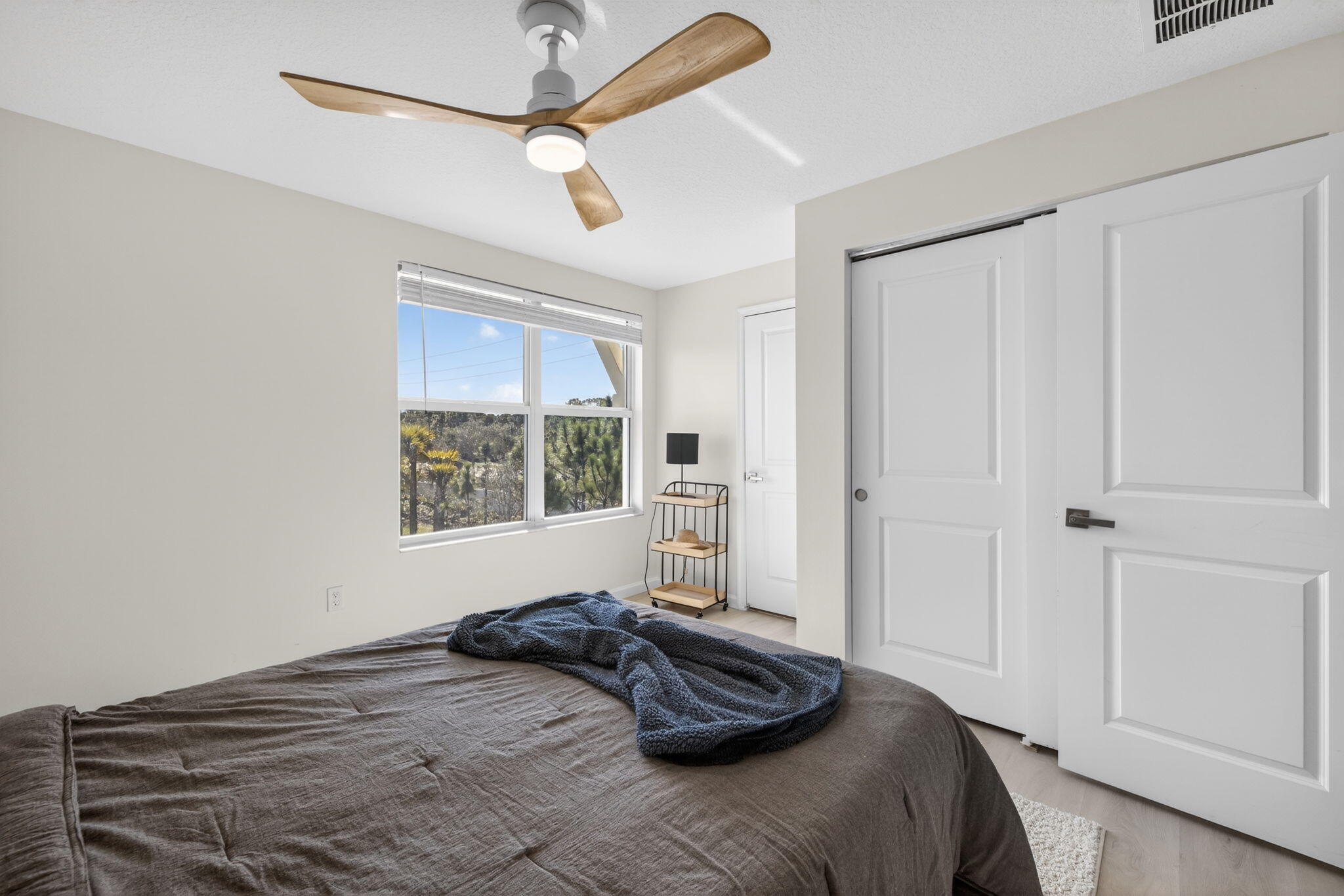 5624 Southeast Edgewater Circle Stuart, FL 34997 - Photo 20 of 33 a bedroom with a bed and a window