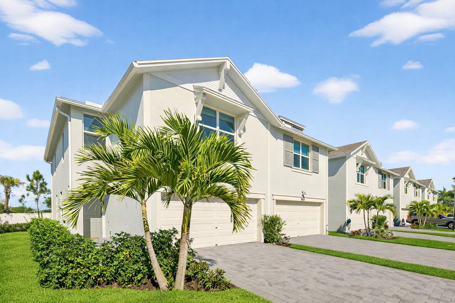 5624 Southeast Edgewater Circle Stuart, FL 34997 - Photo 2 of 33 a front view of a house with a yard