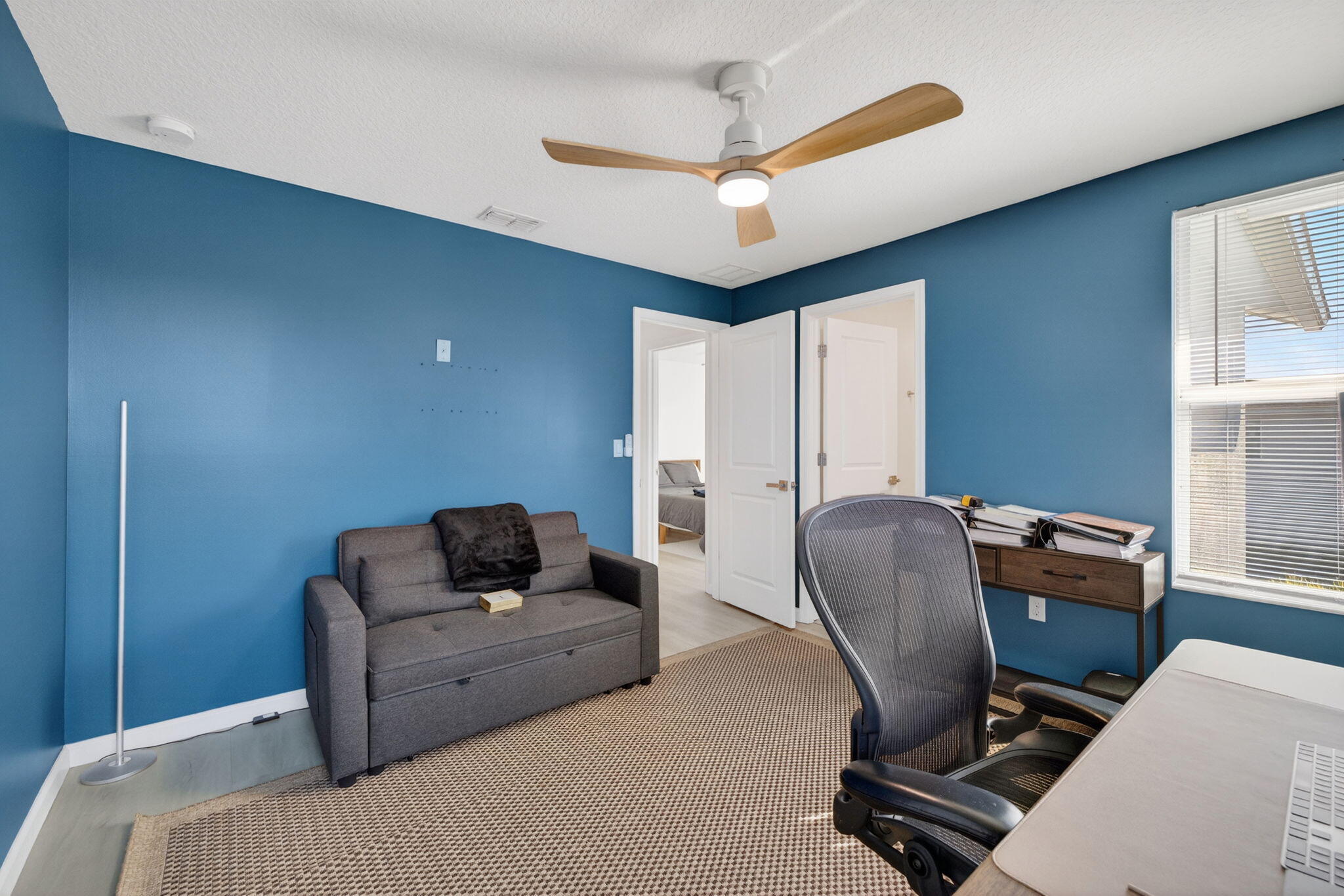 5624 Southeast Edgewater Circle Stuart, FL 34997 - Photo 23 of 33 a bedroom with furniture and a window