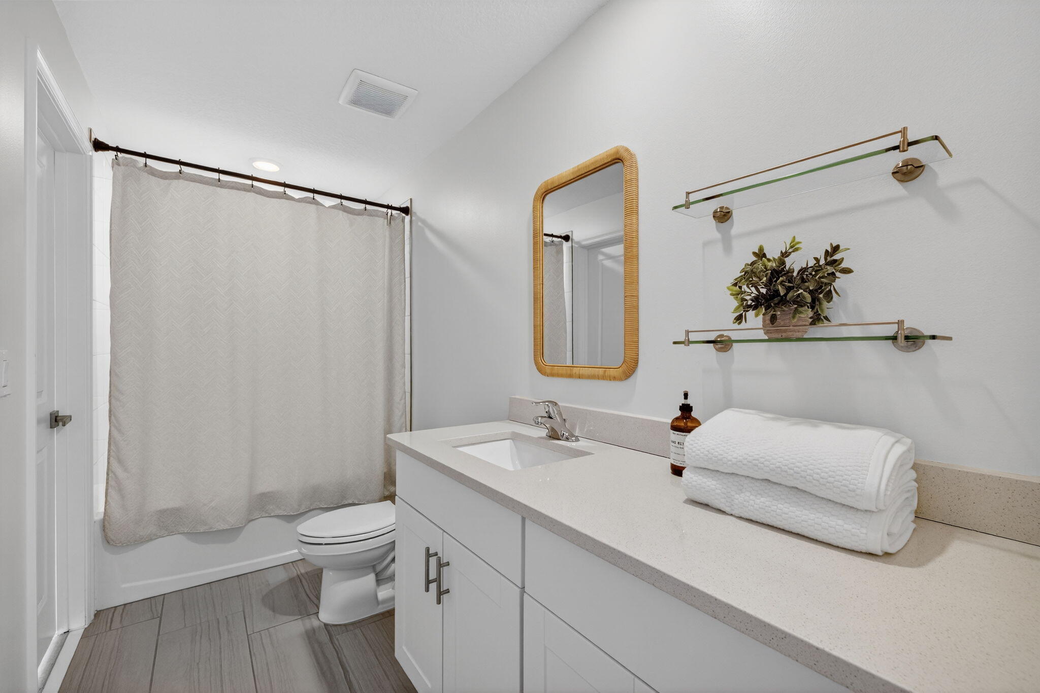 5624 Southeast Edgewater Circle Stuart, FL 34997 - Photo 24 of 33 a bathroom with a sink a toilet and shower