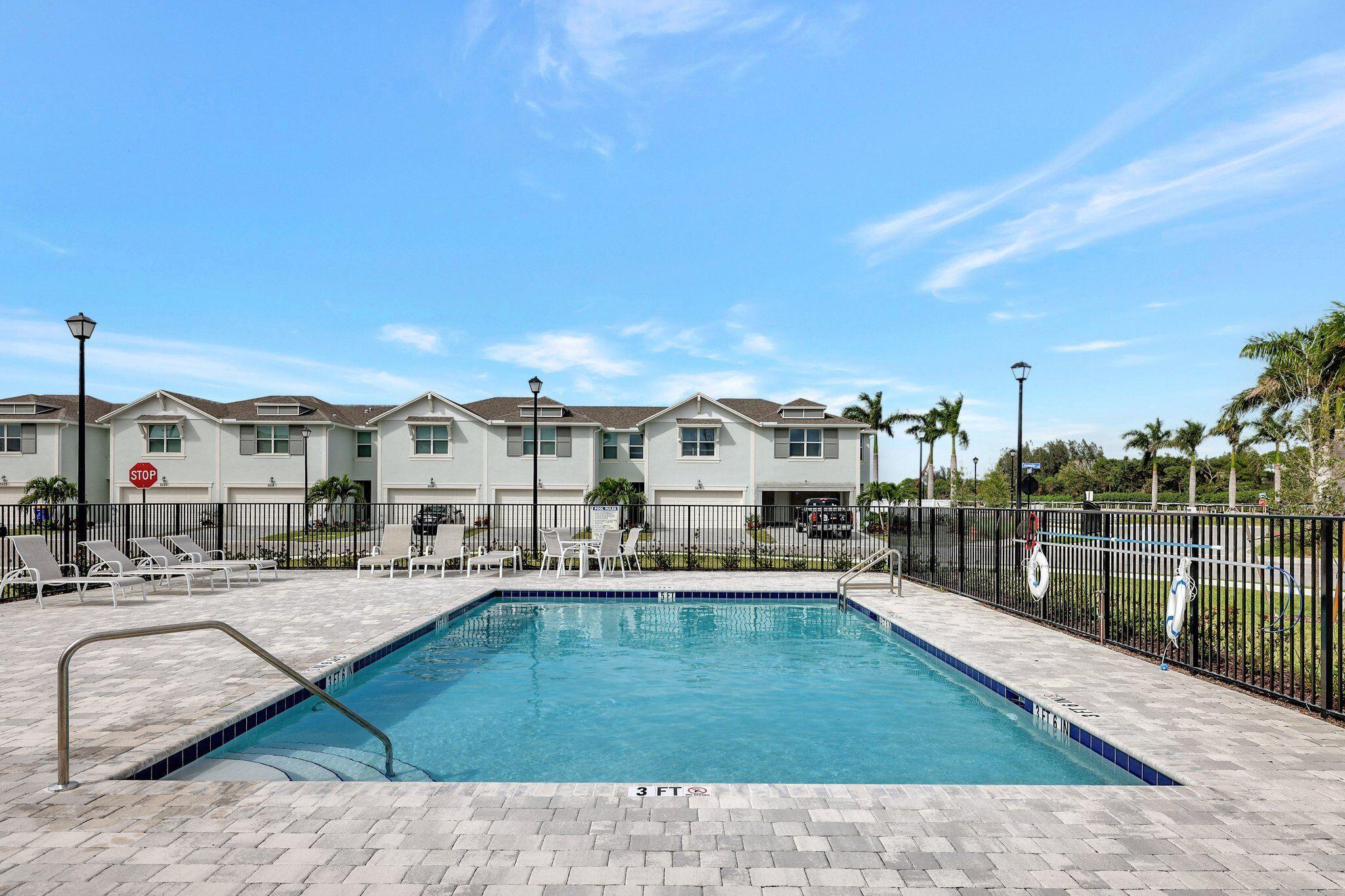 5624 Southeast Edgewater Circle Stuart, FL 34997 - Photo 31 of 33 a view of swimming pool with outdoor seating and plants