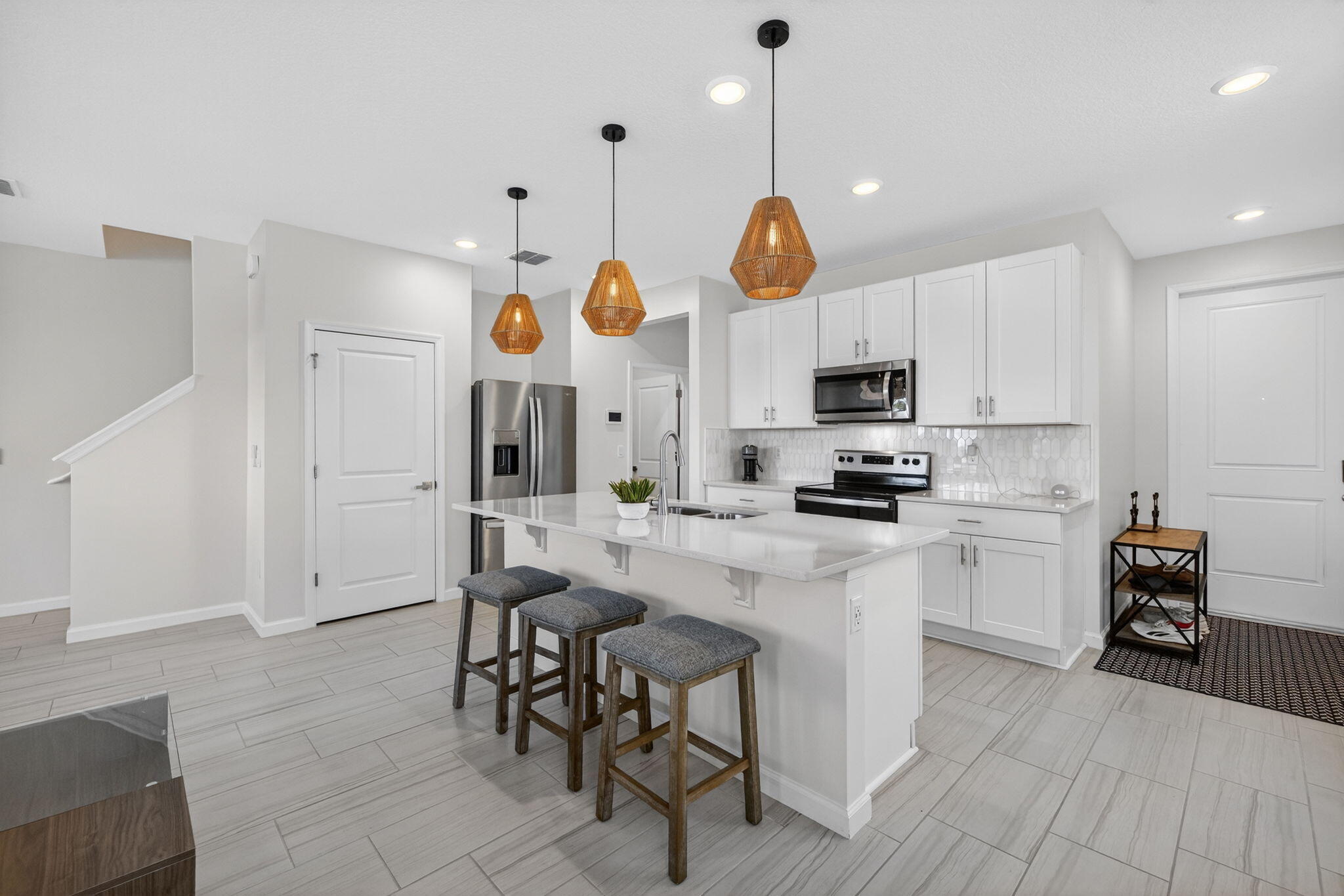 5624 Southeast Edgewater Circle Stuart, FL 34997 - Photo 4 of 33 a kitchen with cabinets and chairs