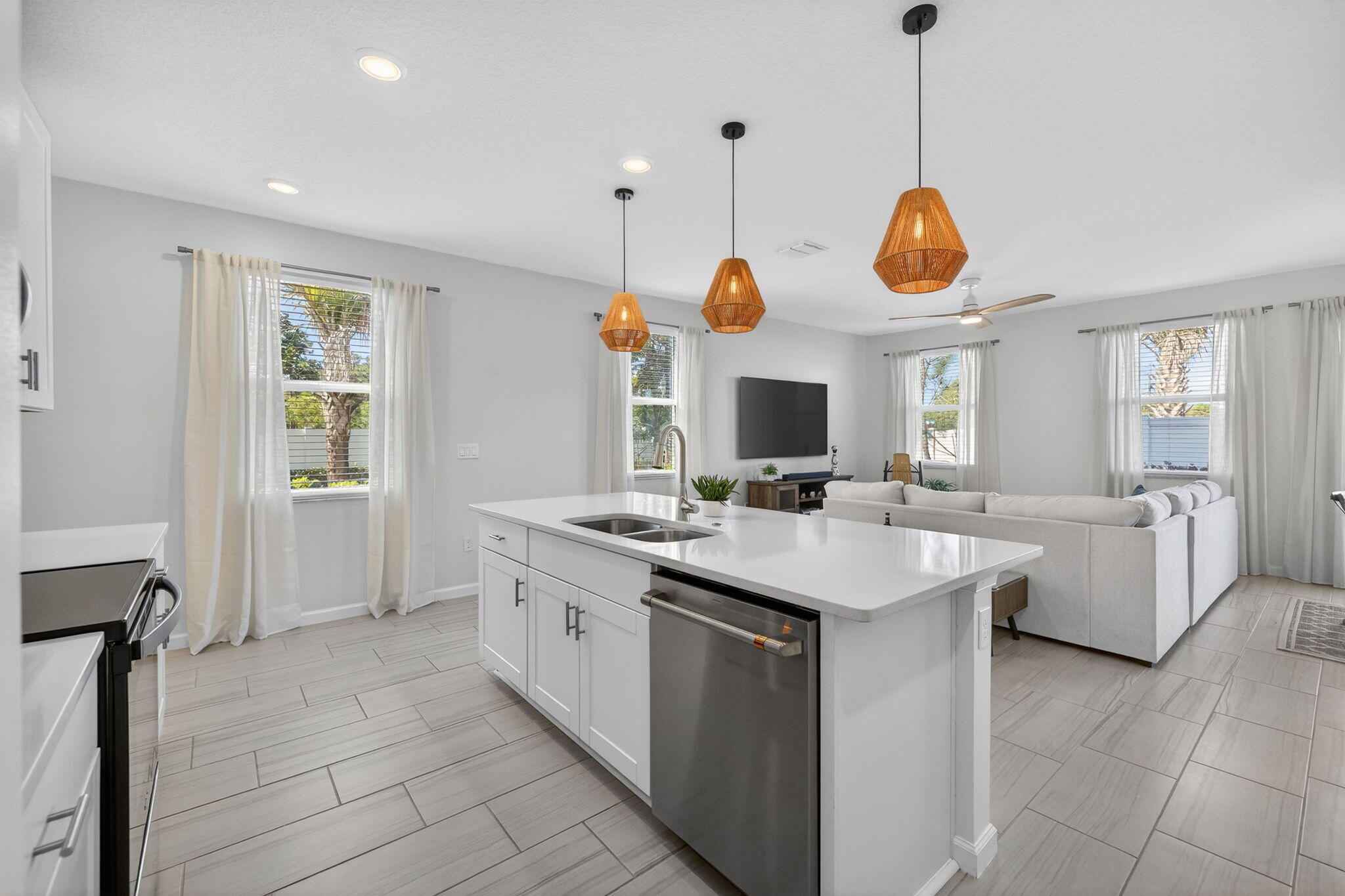 5624 Southeast Edgewater Circle Stuart, FL 34997 - Photo 6 of 33 a kitchen with a sink counter top space appliances and a window