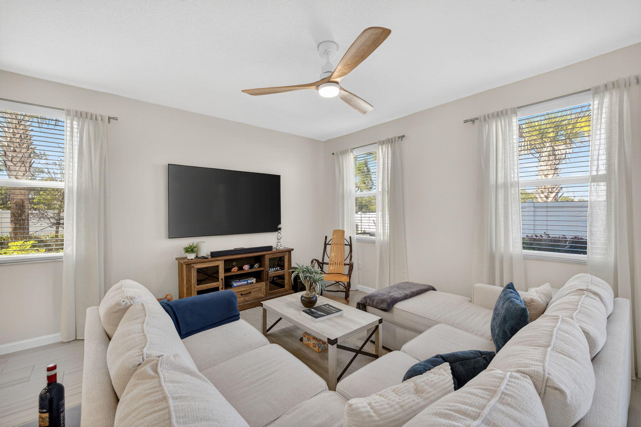 5624 Southeast Edgewater Circle Stuart, FL 34997 - Photo 9 of 33 a living room with furniture and a flat screen tv