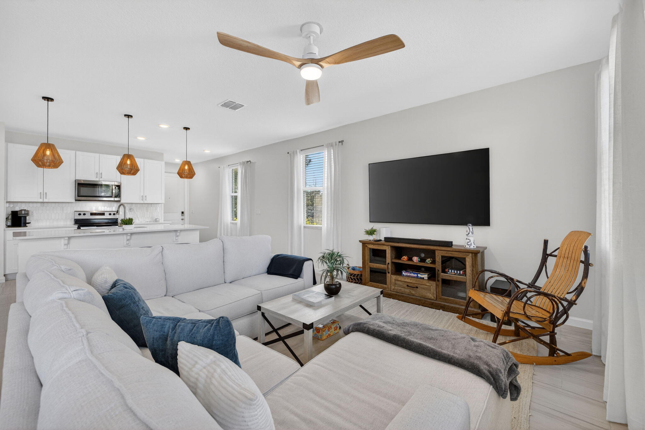 5624 Southeast Edgewater Circle Stuart, FL 34997 - Photo 10 of 33 a living room with furniture and a flat screen tv