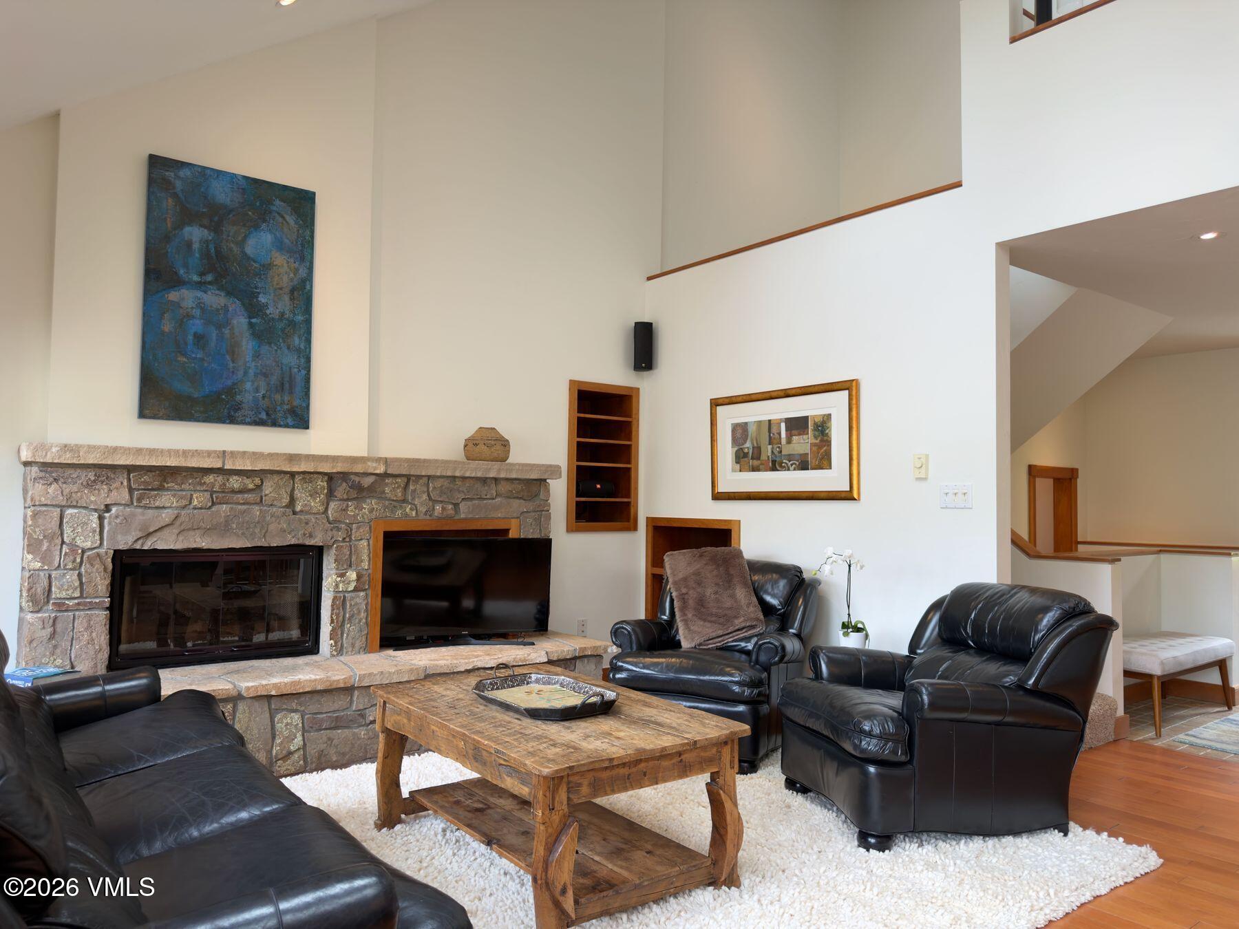 2875 Manns Ranch Road, Unit J2 Vail, CO 81657 - Photo 3 of 25 a living room with furniture and a fireplace