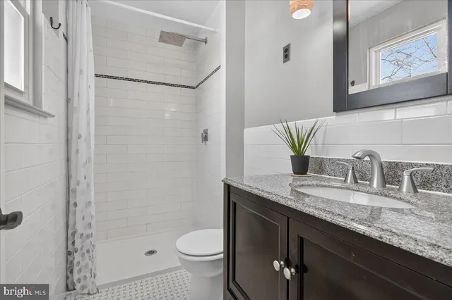 a bedroom with bed and a window