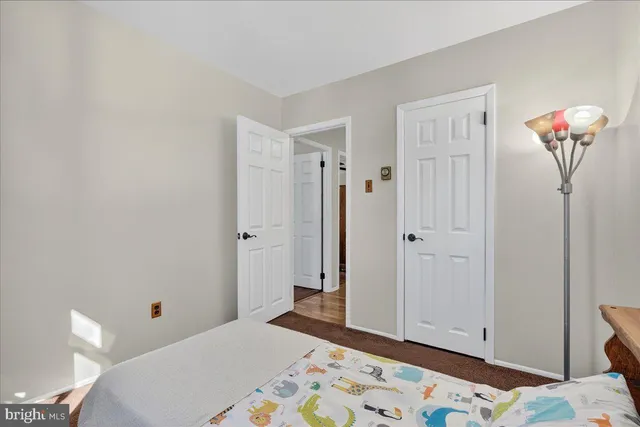 a room with a bed and a window