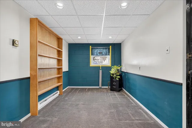 a utility room with cabinets washer and dryer