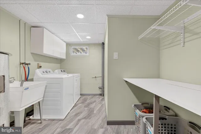 a white toilet sitting next to a bathroom sink