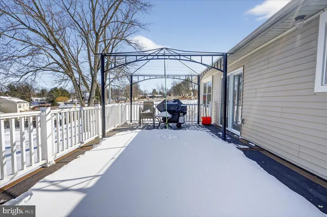 a view of outdoor space with wooden floor and outdoor seating