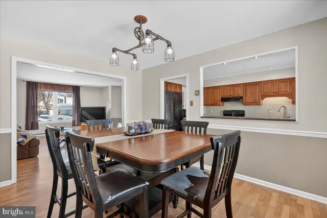 a kitchen with stainless steel appliances granite countertop a refrigerator stove top oven a sink and dishwasher