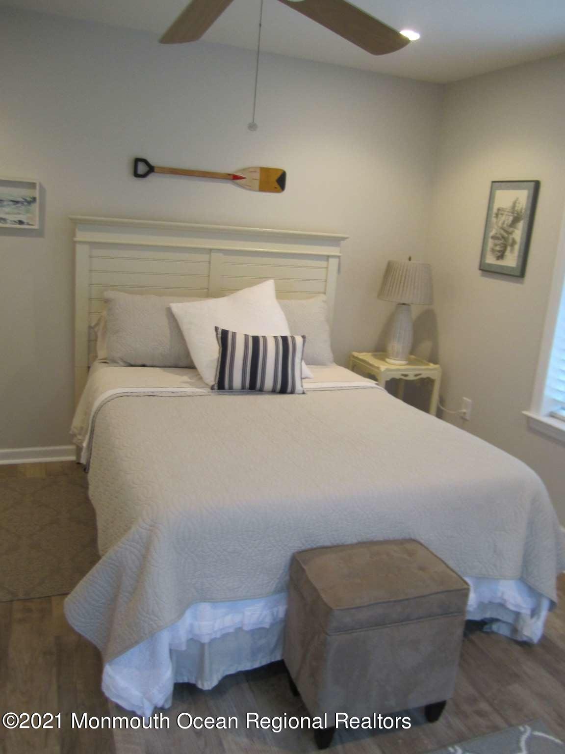 111 Marlin Road Tuckerton, NJ 08087 - Photo 7 of 23 a bedroom with a bed and mirror