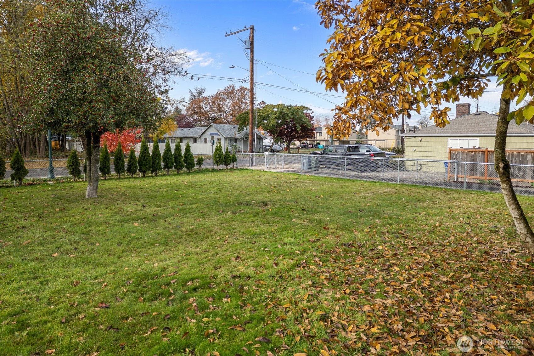 5703 Parker Road East, Unit 1 Sumner, WA 98390 - Photo 6 of 10 a view of a park with a house in the background
