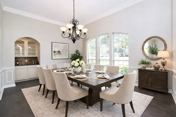 a large kitchen with kitchen island a sink a stove and cabinets