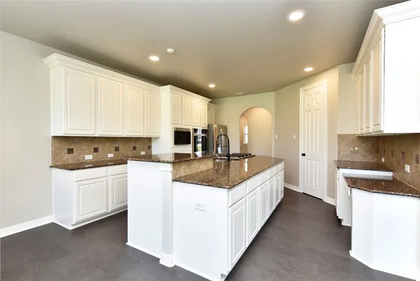 a bedroom with a bed and ceiling fan