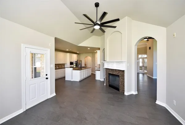 a kitchen with granite countertop a sink and a stove
