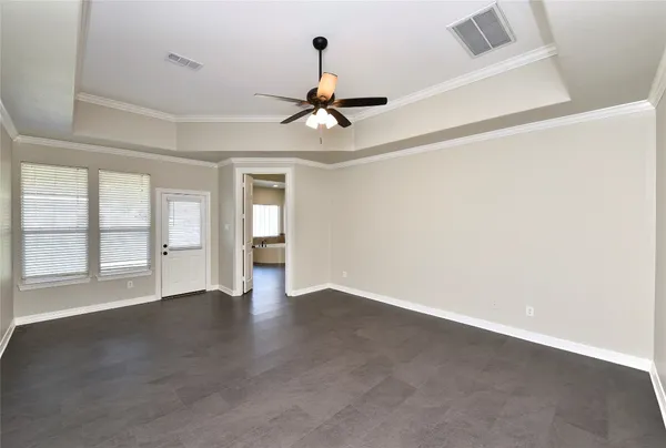 a view of a house with yard and basketball court