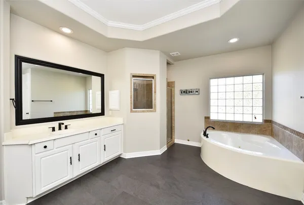 a view of a livingroom with a window and a ceiling fan