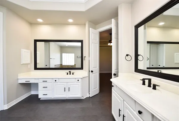 a living room with furniture a rug and a chandelier