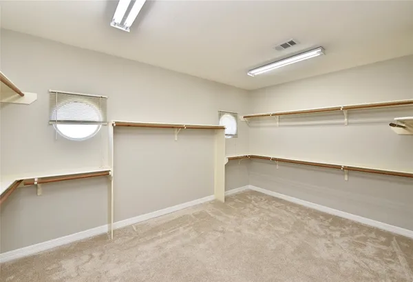 a kitchen with granite countertop a sink stove and refrigerator