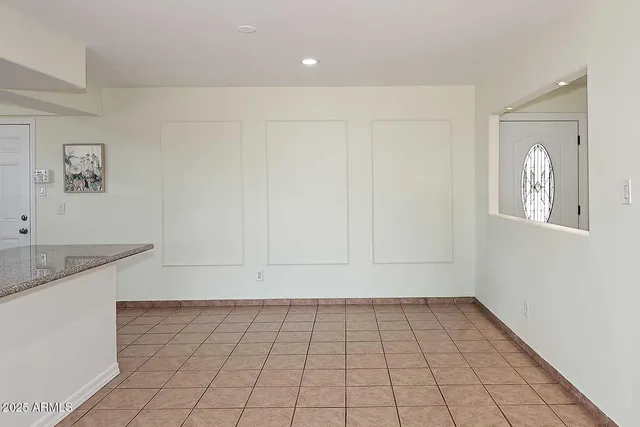 a view of a kitchen with white cabinets a sink and dishwasher