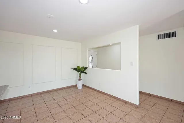 a view of an empty room and window