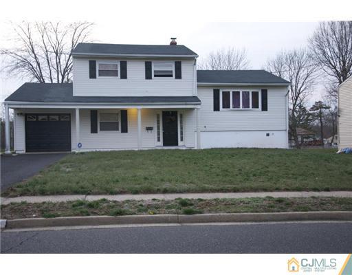 8 Newkirk Road Somerset, NJ 08873 - Photo 1 of 1 a front view of a house with a yard